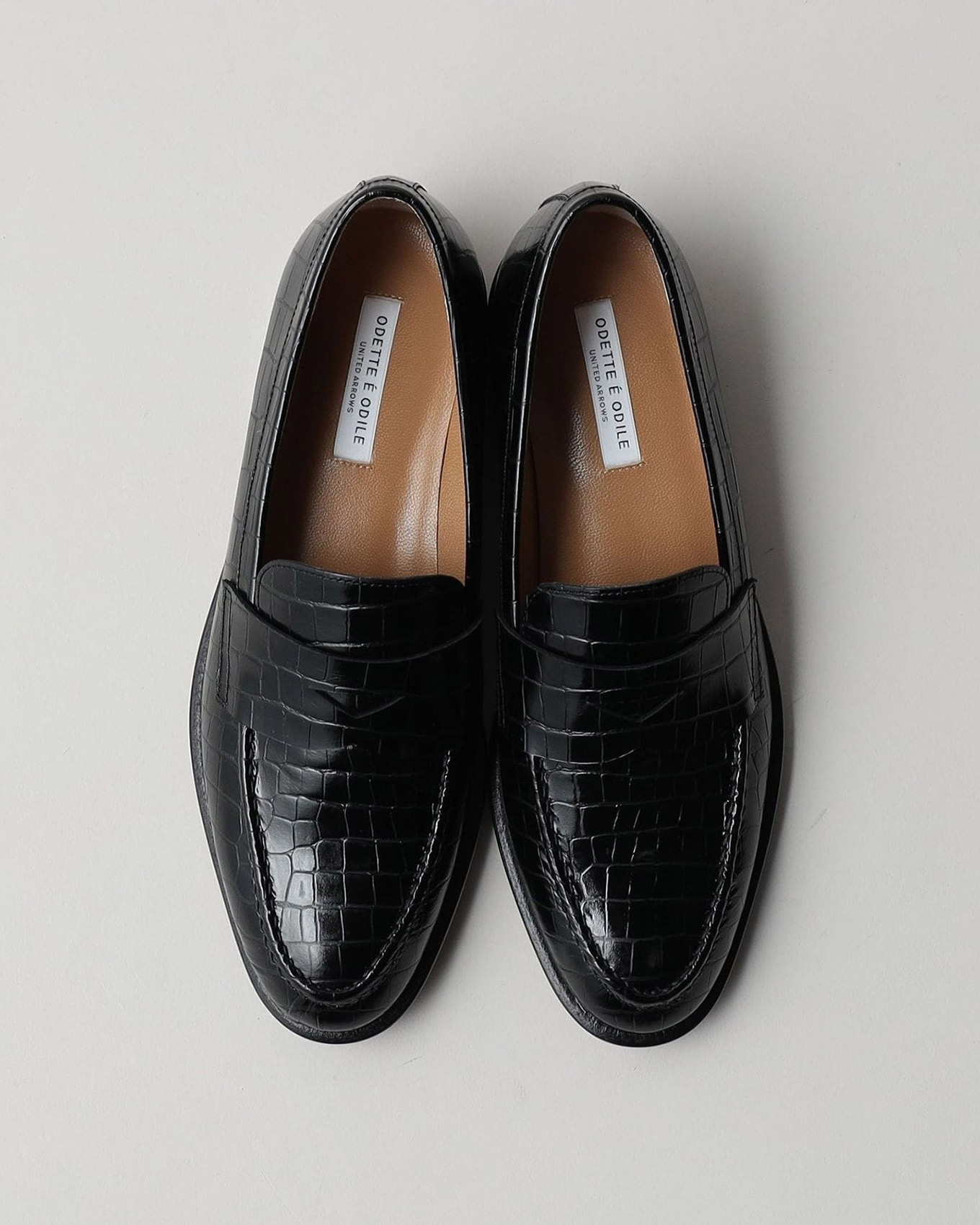 『オデット エ オディール』のペニーローファー 型押しのブラック